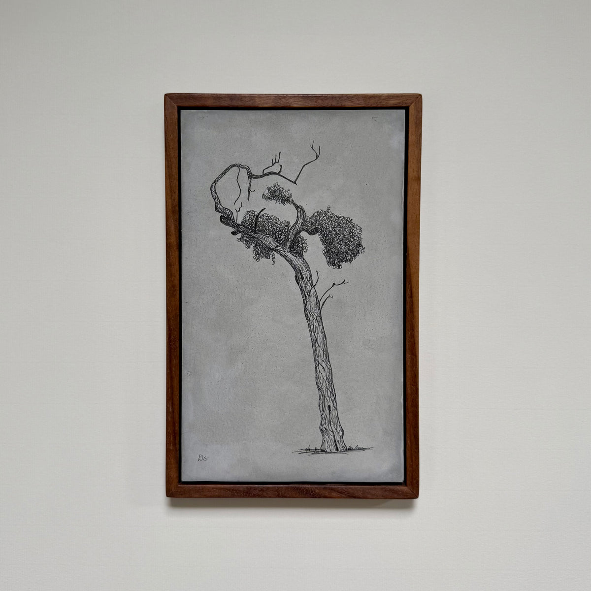 Framed original tree drawing titled Athens, created in ink on cement and photographed hanging on a pale wall.