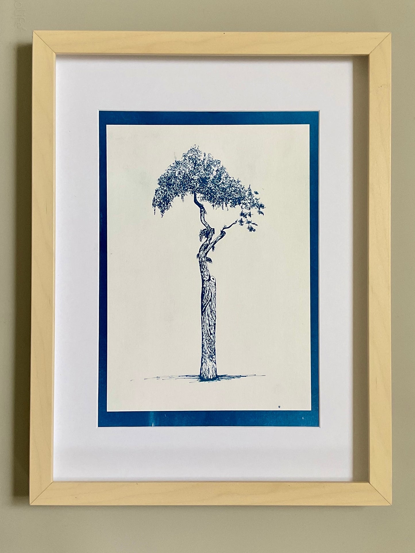 Framed cyanotype of the Athens Parasol Tree in positive — a deep blue tree on a light background, handmade using traditional sun-exposed cyanotype printing.