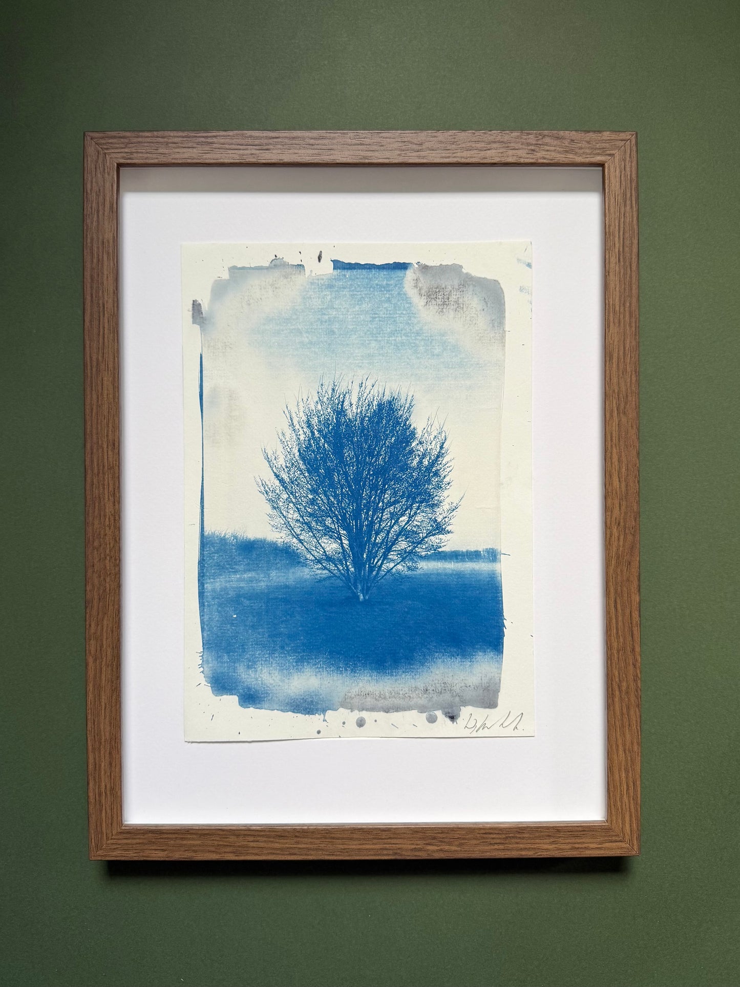  A4 Hackney Marshes cyanotype displayed with a white mount in a dark wooden frame.
