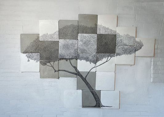 Large original tree drawing made across 24 square cement tiles, with detailed ink canopy and curving trunk.