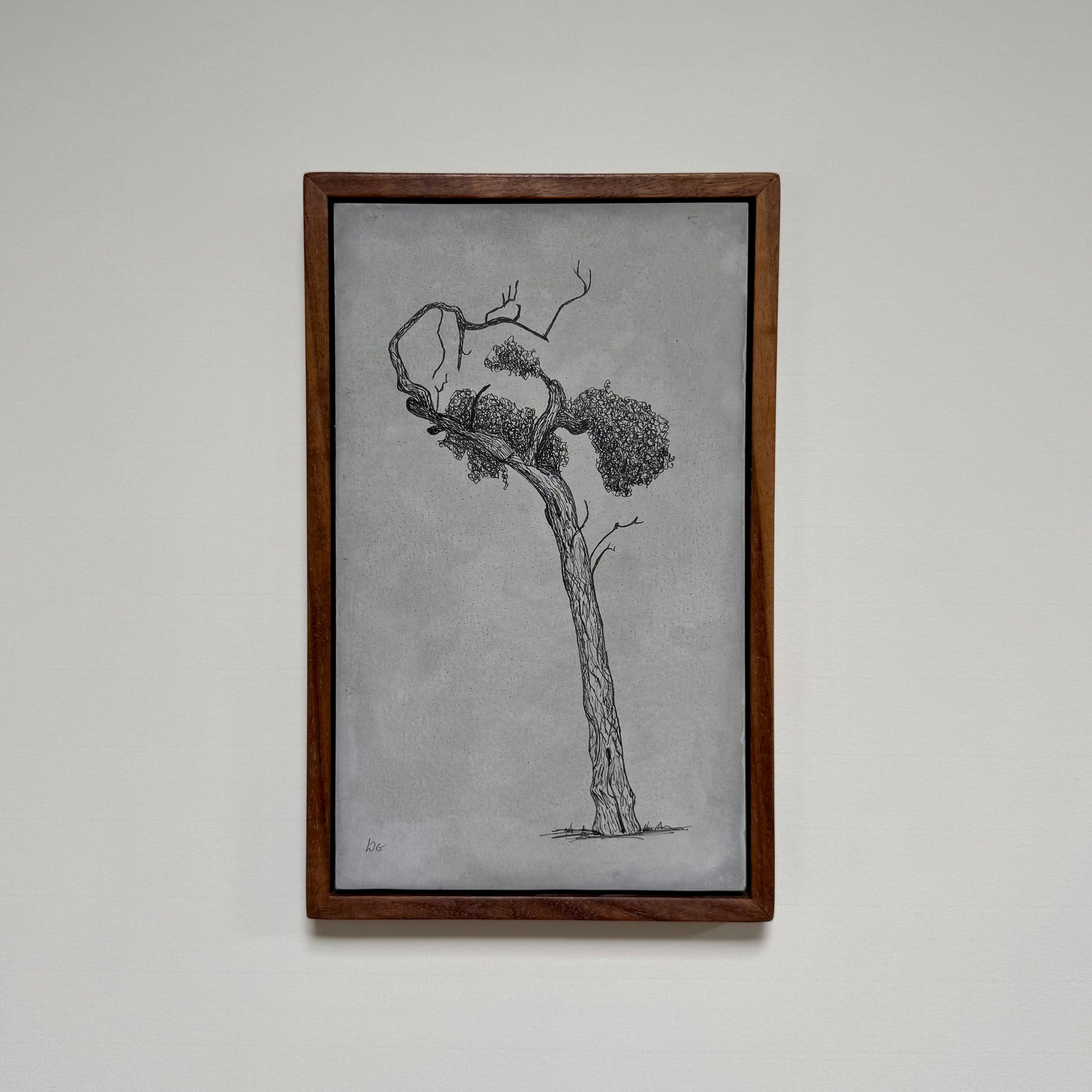 Framed original tree drawing titled Athens, created in ink on cement and photographed hanging on a pale wall.