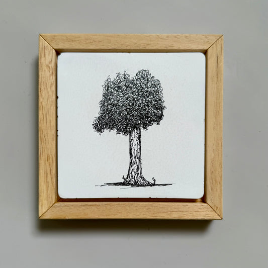 “Framed ink drawing of a single tree on white cement tile by Warren Garland. Minimalist design with natural wood frame.”