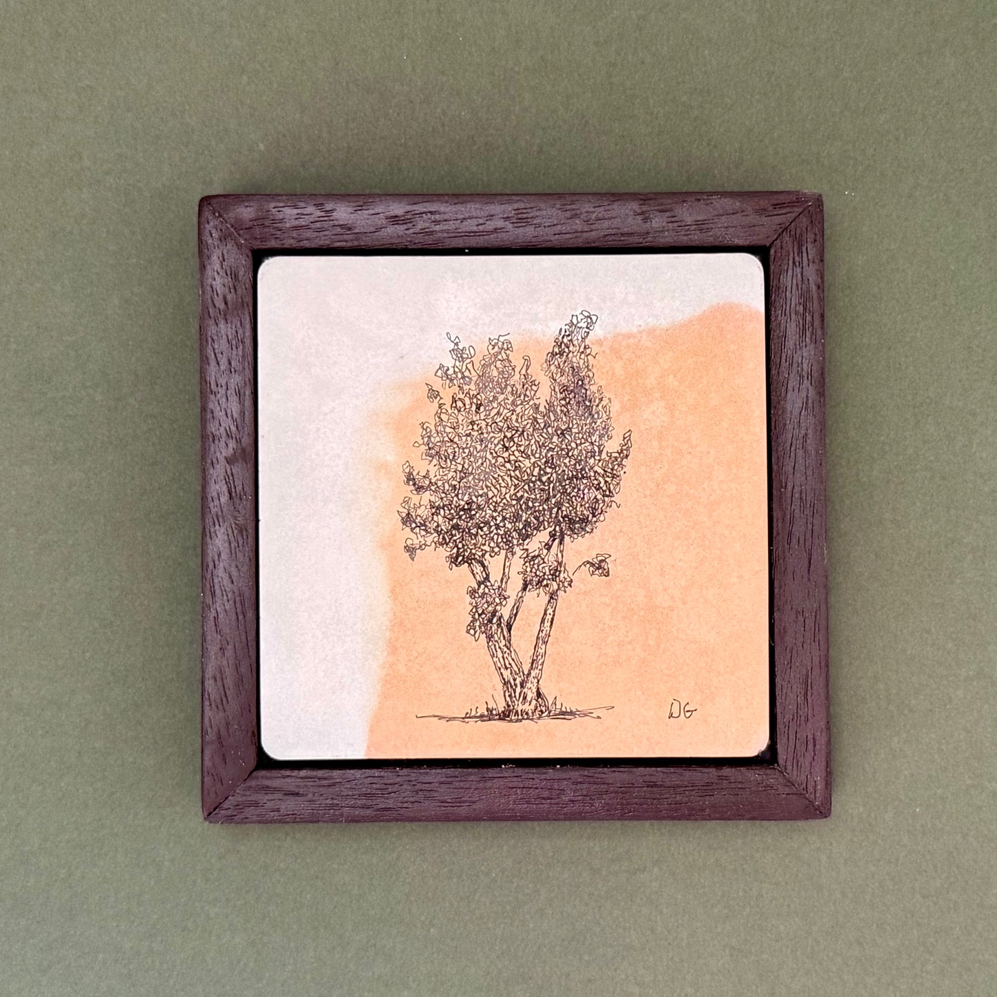 Original ink drawing of the Beacon Hill tree in the Lickey Hills on a hand-cast cement tile with warm terracotta marbling, framed in a bespoke dark wooden frame by Birmingham artist Warren Garland.
