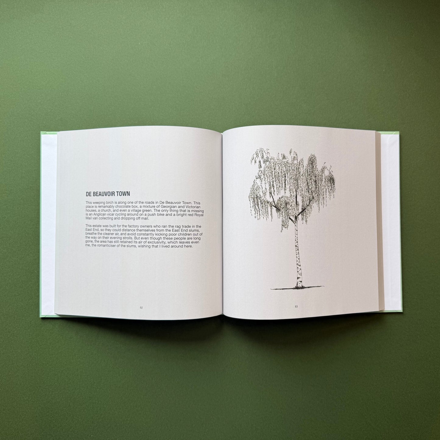 Open pages of Hackney Trees second edition artist book by Warren Garland, featuring a pen and ink tree drawing alongside written reflections on Dalston, East London.