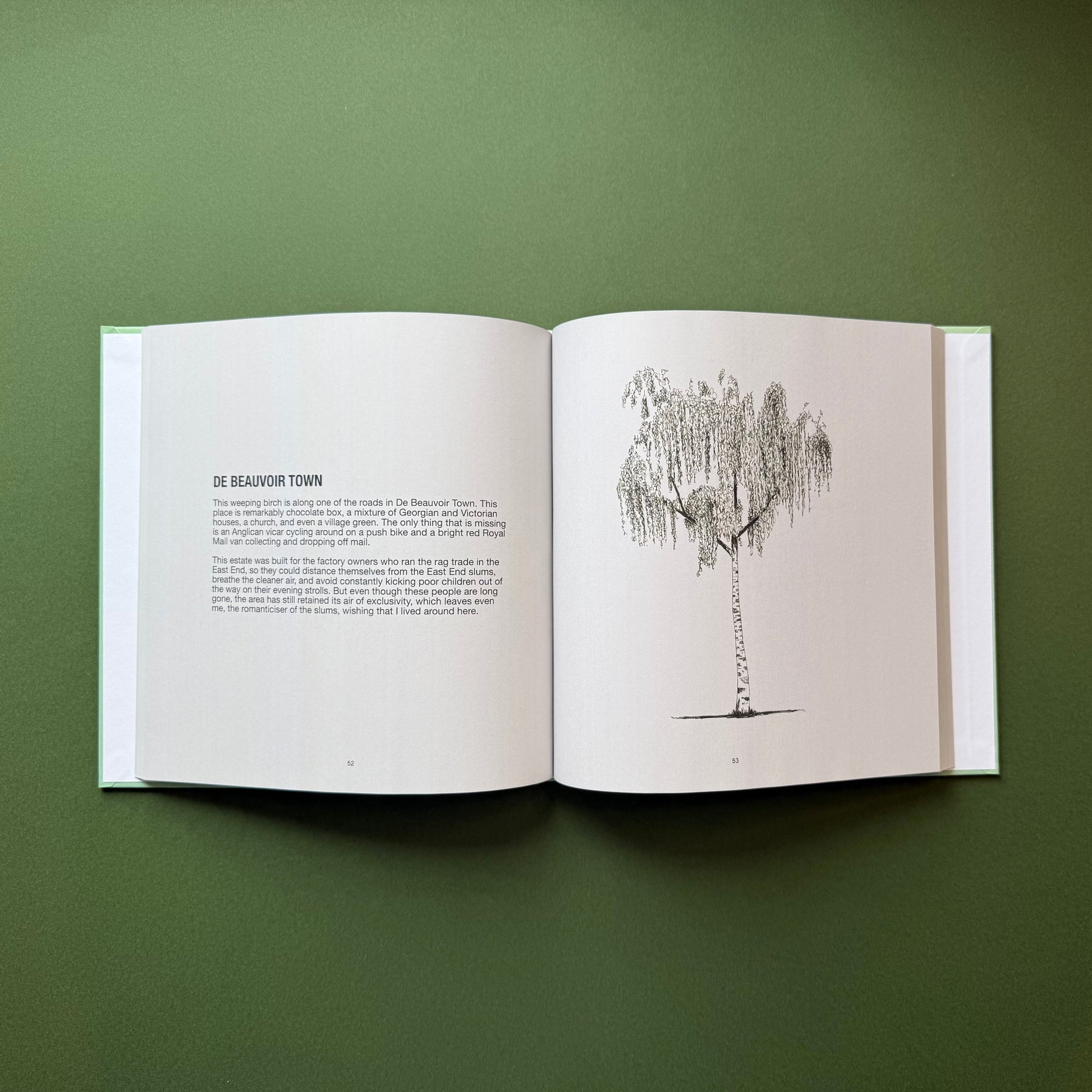 Open pages of Hackney Trees second edition artist book by Warren Garland, featuring a pen and ink tree drawing alongside written reflections on Dalston, East London.