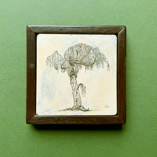 Original black ink drawing of a tree in Victoria Park, London, with a thick trunk and drooping willow-like branches. Drawn on hand-cast pigmented Portland cement with subtle blue and cream tones, presented in a dark wooden frame against a green background.